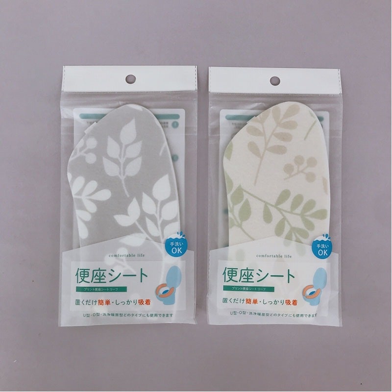 Can Do leaf print washable toilet seat sheet packaging in gray and white