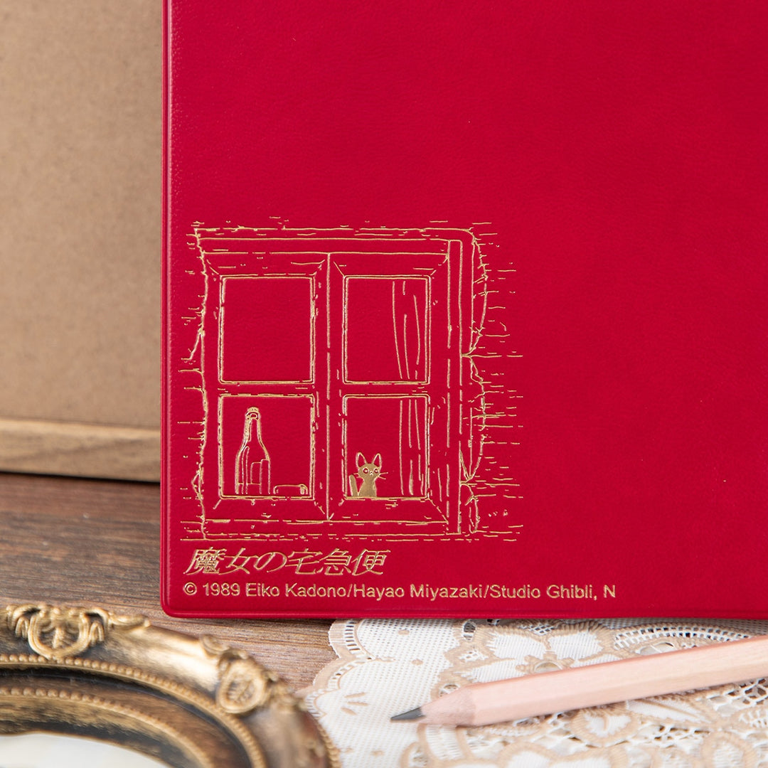 Kiki's Delivery Service 2027 planner cover detail with gold foil design