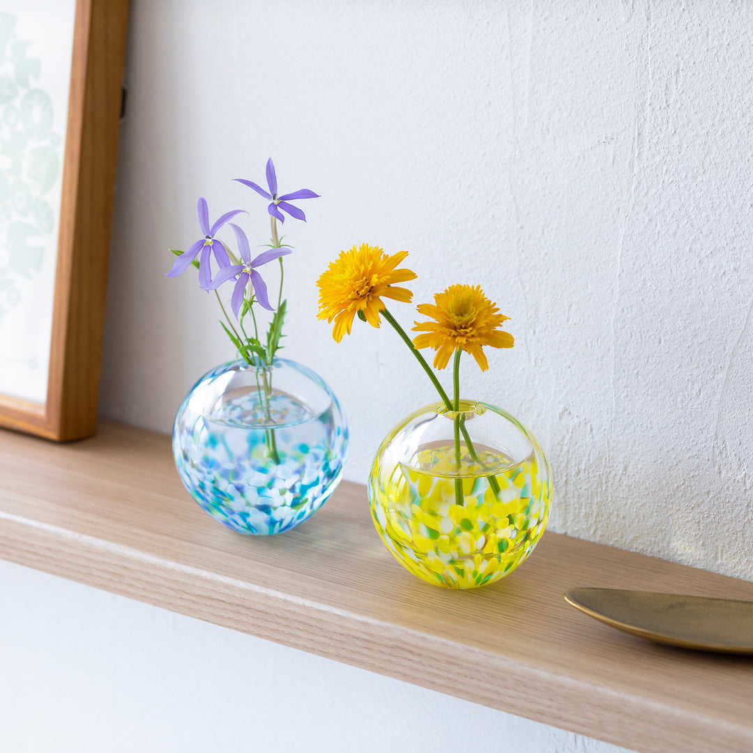 Tsugaru Vidro Sunflower glass bud vase displayed on a shelf with flowers