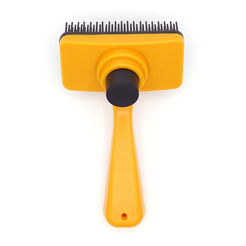 Pet grooming brush cleaning button detail
