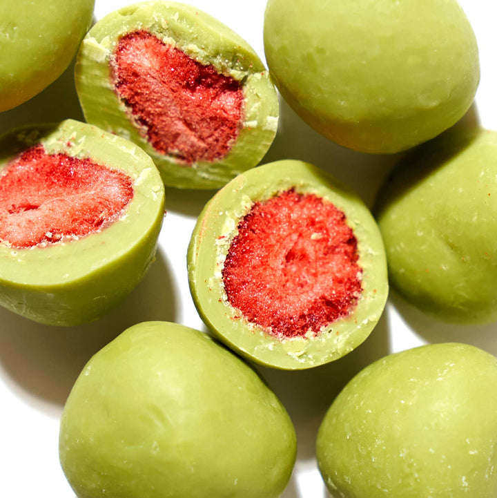 Close-up of matcha chocolate-coated freeze-dried strawberry