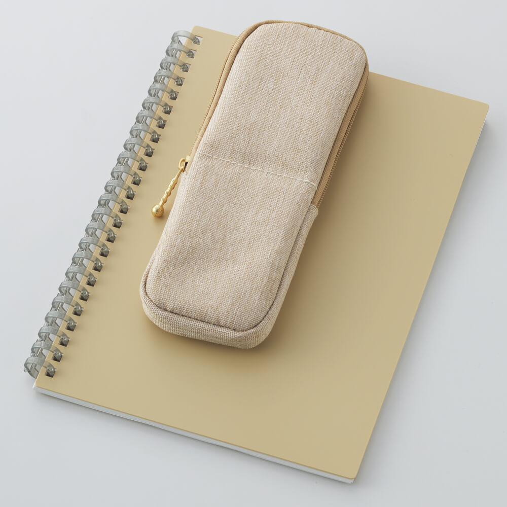 LIHIT LAB Mutual Clip Pen Case Ivory on notebook