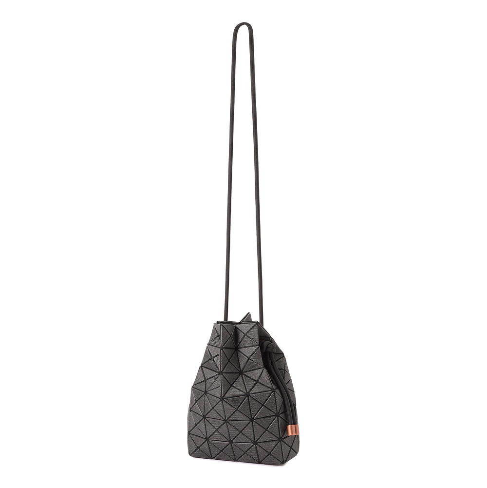 BAO BAO ISSEY MIYAKE WRING DENIM Black drawstring bag side detail with geometric panels