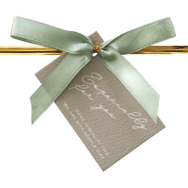 Green ribbon gift tie detail