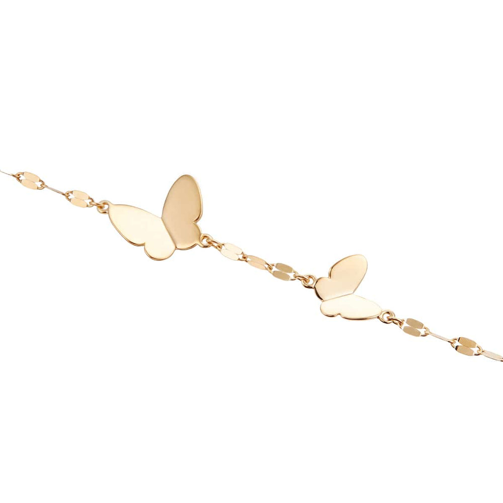 TSUTSUMI RBL659 butterfly bracelet worn on wrist in K10 yellow gold