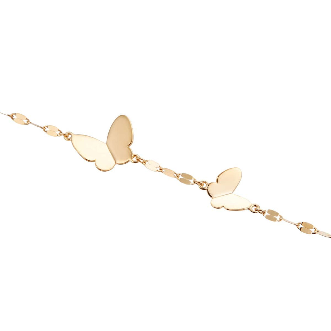TSUTSUMI RBL659 butterfly bracelet worn on wrist in K10 yellow gold