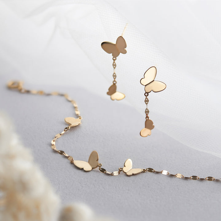 TSUTSUMI K10 yellow gold butterfly bracelet styling detail